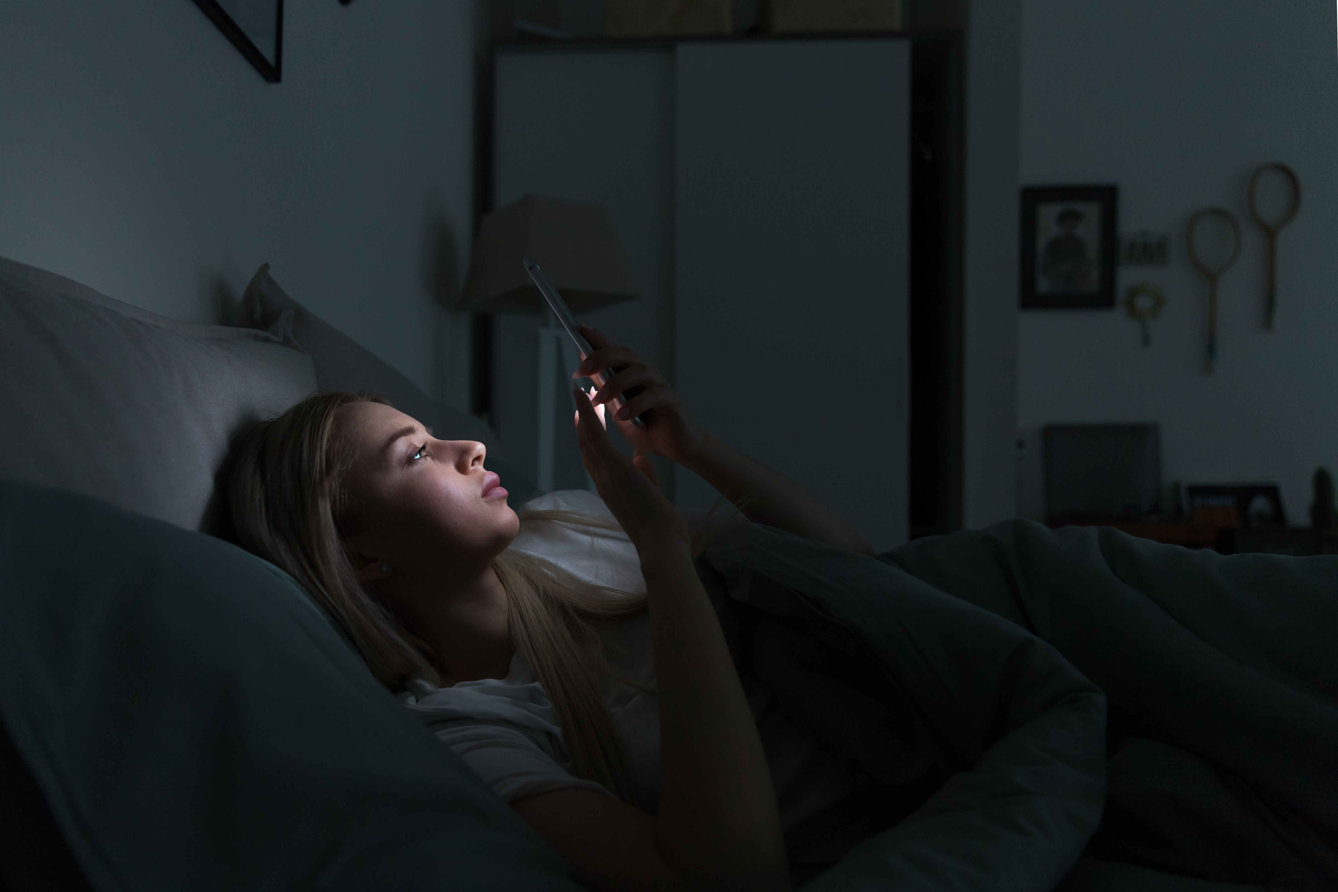 A person lying awake, unable to sleep